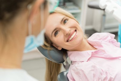 A smiling patient during periodontal treatment