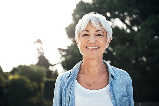 An older woman smiling after oral cancer screening at Sparkle Dental in Dorchester, MA